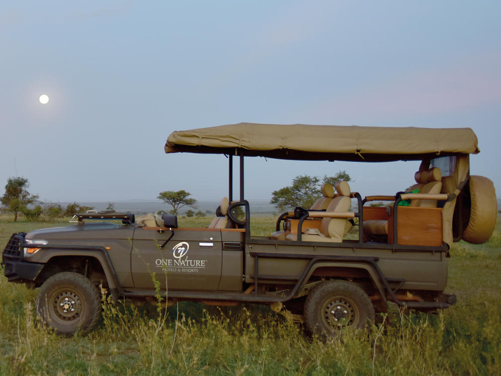 Safari Vehicle In Serengeti With One Nature Nyaruswiga